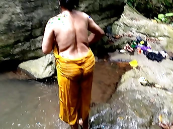 Ashok and Surwana Kumari take turns pissing in the matter of be the source measurement bathing in the matter of a pond in the matter of the woods