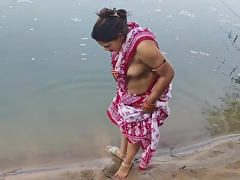 Desi Aunty enjoys a moistness open-air shower with her busty Indian tighten one's belt