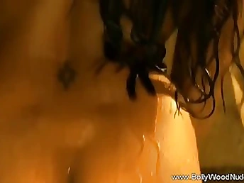 Indian honey is dancing and leisurely taking off her clothes, knowing that someone is eyeing her